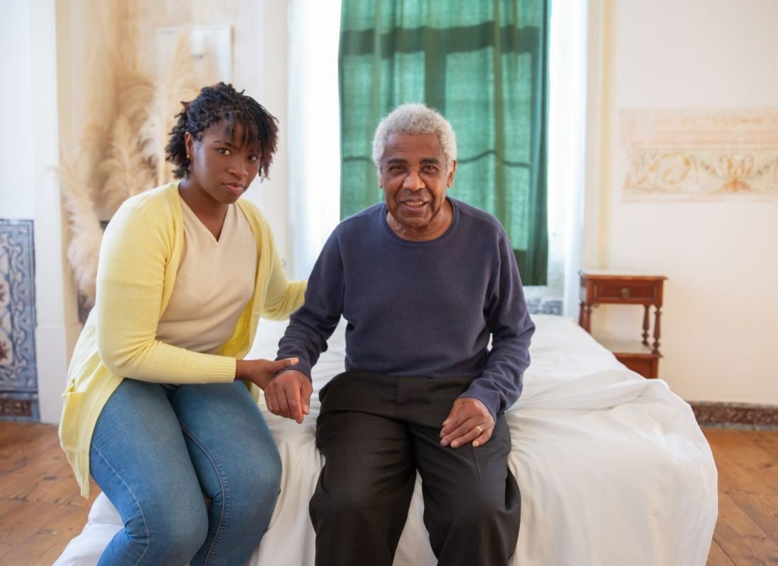 Caregiver assisting a senior client at home